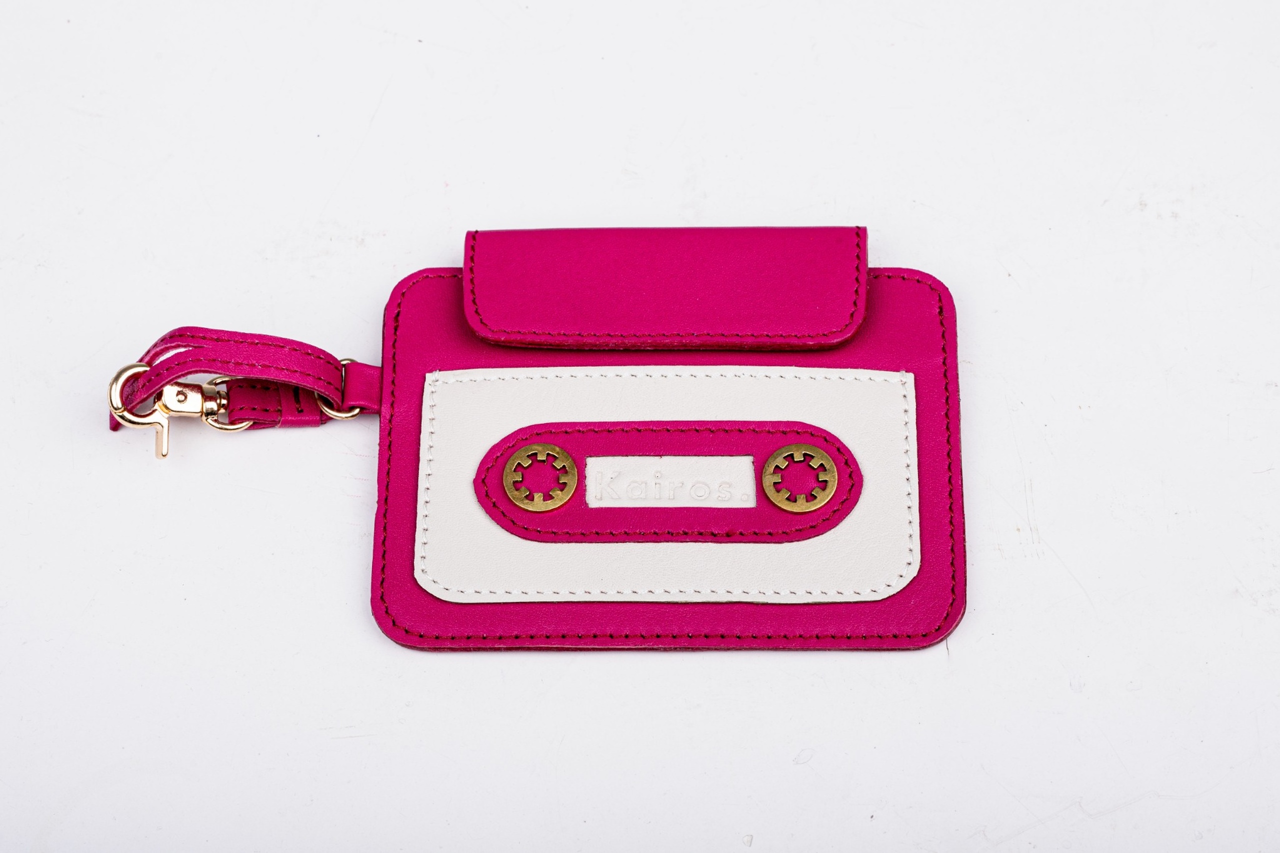 Pink and white leather cassette cardholder by Kairos with gold hardware and wrist strap